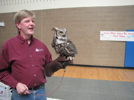 Man holding an owl