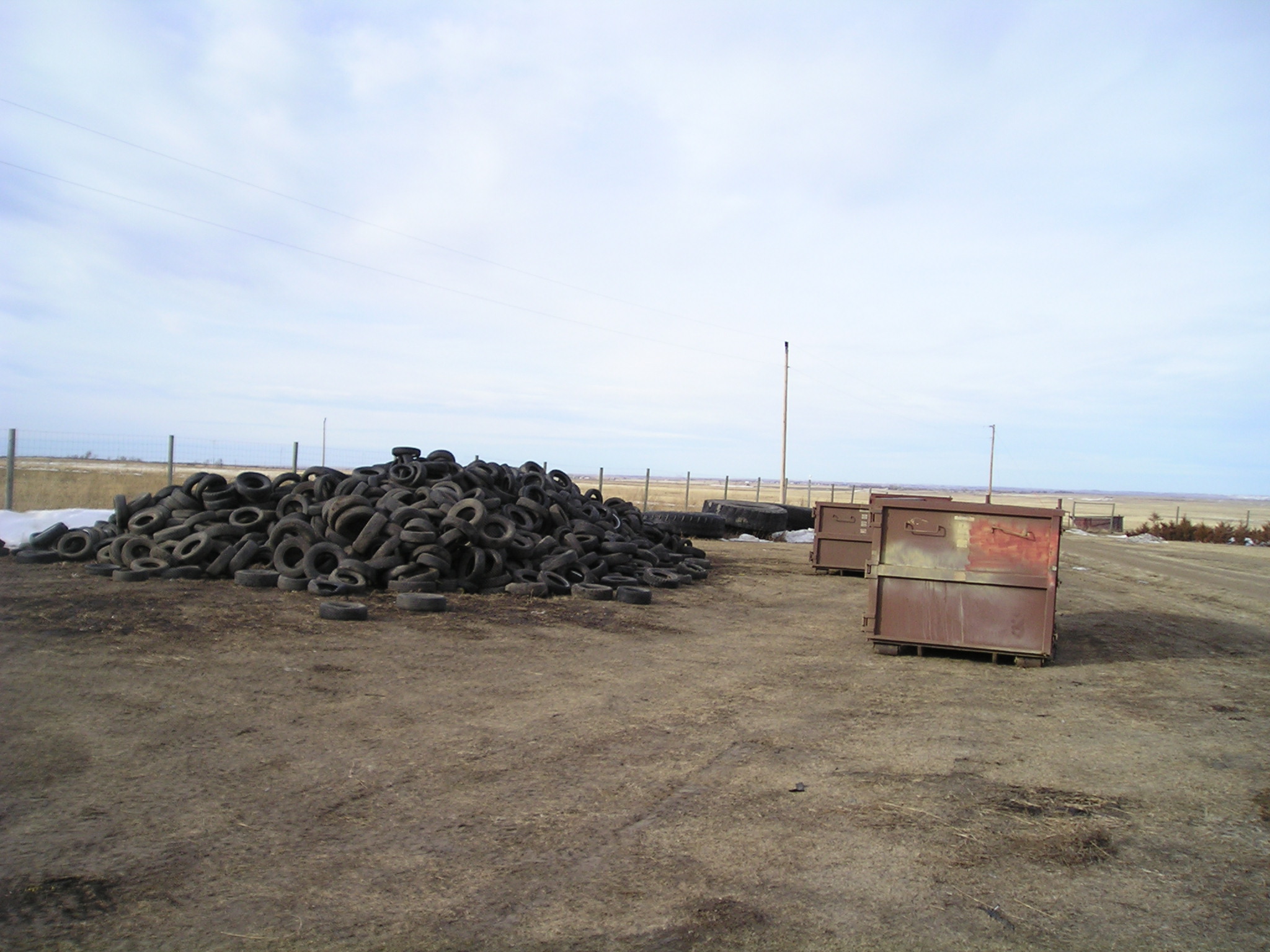 Waste tire pile before clean up